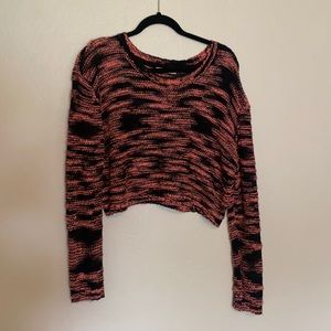 Cropped sweater, very stylish.